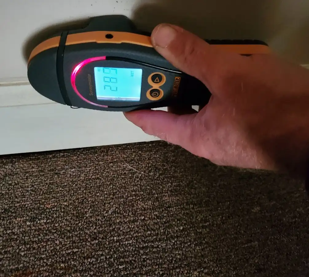 Moisture detection at baseboard during Storm Damage Restoration in St. Thomas